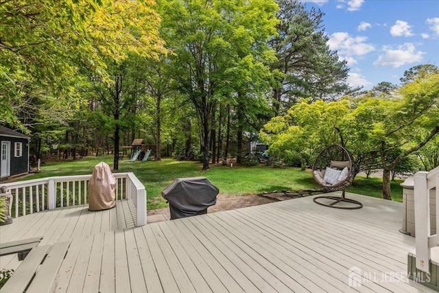 383 S Stump Tavern Rd S, Jackson, NJ 08527 - wooden terrace with a yard, a playground, a grill, and view of scattered trees