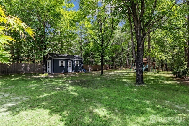 383 S Stump Tavern Rd S, Jackson, NJ 08527 - fenced backyard with an outbuilding and a playground