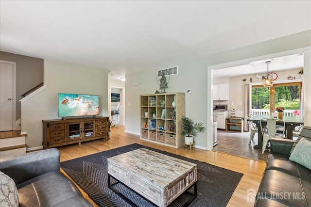 383 S Stump Tavern Rd S, Jackson, NJ 08527 - living area with stairs and light wood-style flooring