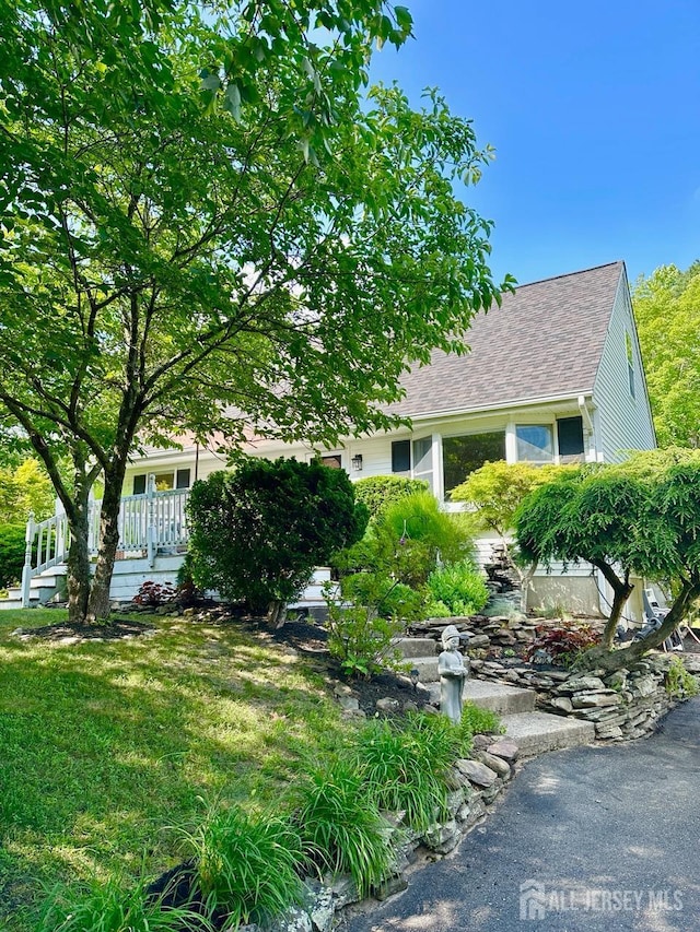 383 S Stump Tavern Rd S, Jackson, NJ 08527 - view of property hidden behind natural elements with roof with shingles