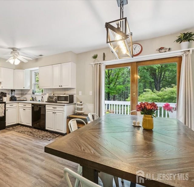 383 S Stump Tavern Rd S, Jackson, NJ 08527 - dining area with ceiling fan and light wood-style floors