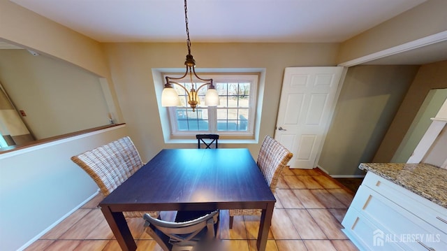 dining space featuring a notable chandelier and light hardwood / wood-style floors