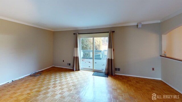 unfurnished room with light parquet flooring and crown molding