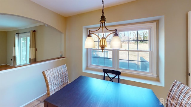 dining area featuring a notable chandelier