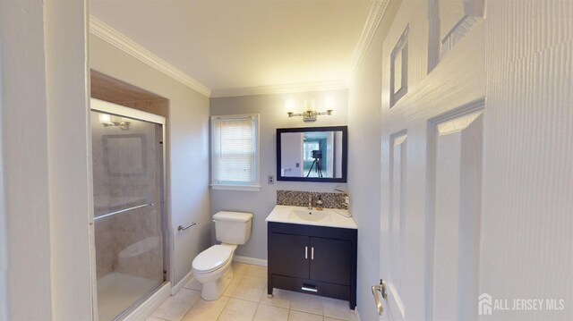 bathroom featuring tile patterned flooring, a shower with shower door, toilet, vanity, and crown molding