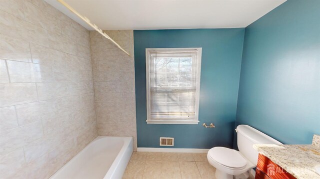 full bathroom with shower / bath combination, tile patterned flooring, vanity, and toilet