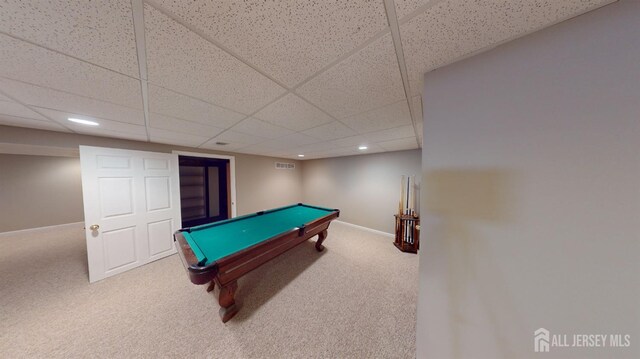 recreation room with a paneled ceiling, carpet floors, and billiards