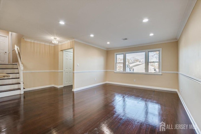 unfurnished room with baseboards, stairs, ornamental molding, recessed lighting, and wood finished floors