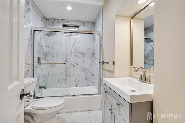 full bath featuring bath / shower combo with glass door, toilet, recessed lighting, marble finish floor, and vanity