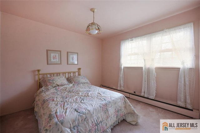 carpeted bedroom with a baseboard radiator