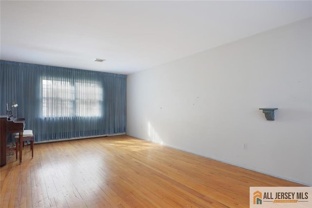 spare room with light wood-style flooring