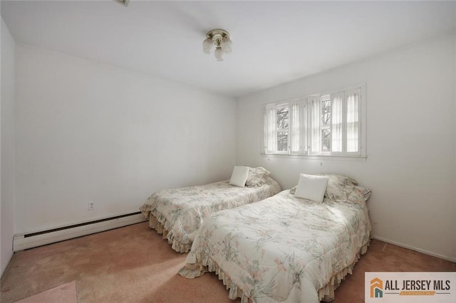 carpeted bedroom with a baseboard radiator