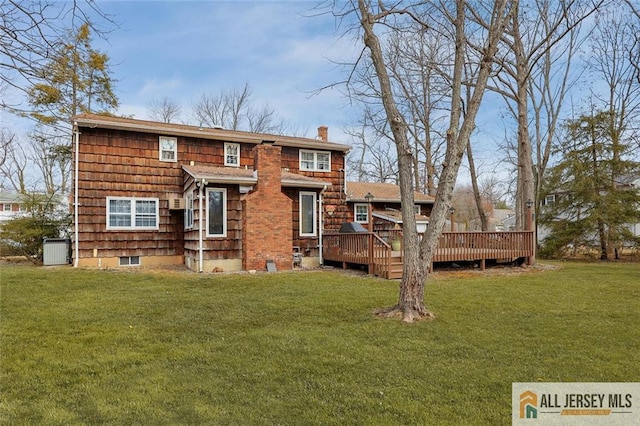 rear view of house featuring a wooden deck, central AC unit, a chimney, and a yard