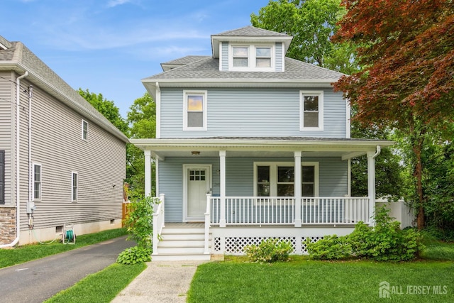 345 1st St, Dunellen, NJ 08812 - traditional style home featuring a porch, roof with shingles, and a front lawn