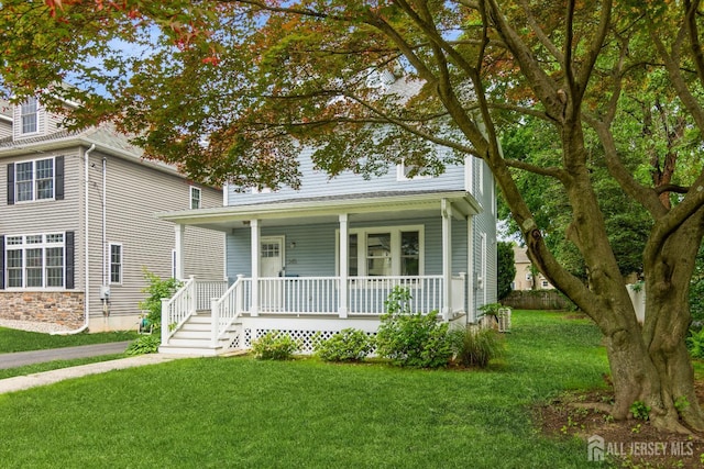 345 1st St, Dunellen, NJ 08812 - view of front of house featuring covered porch and a front yard