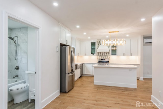 345 1st St, Dunellen, NJ 08812 - kitchen featuring stainless steel appliances, a wall mounted AC, white cabinetry, baseboards, and recessed lighting