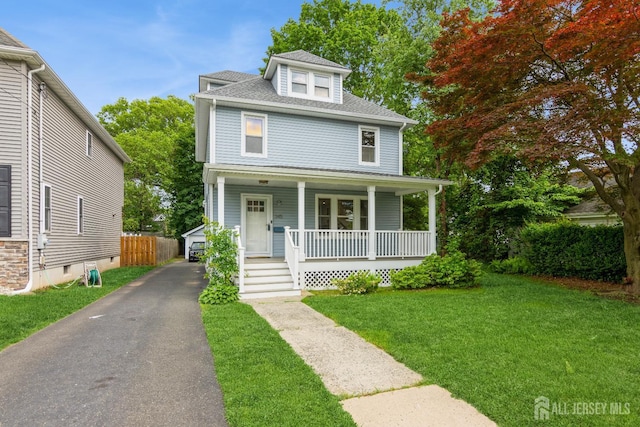 345 1st St, Dunellen, NJ 08812 - traditional style home with covered porch, roof with shingles, and a detached garage