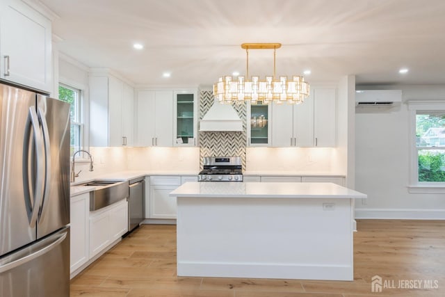 345 1st St, Dunellen, NJ 08812 - kitchen featuring stainless steel appliances, a wall mounted AC, a sink, plenty of natural light, and recessed lighting