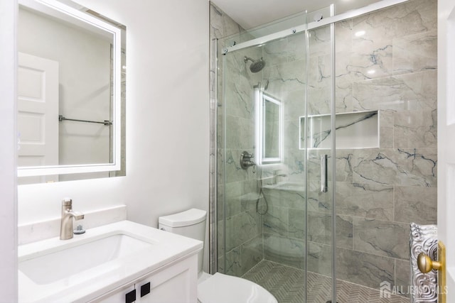 345 1st St, Dunellen, NJ 08812 - bathroom featuring vanity, toilet, and a shower stall