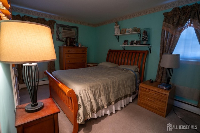 carpeted bedroom with a wall unit AC