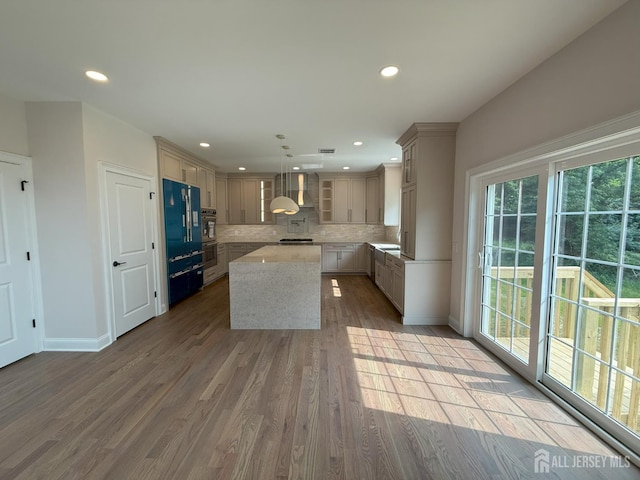 2 Joye Ln, South Brunswick, NJ 08852 - kitchen with a center island, tasteful backsplash, wall chimney exhaust hood, light wood finished floors, and recessed lighting
