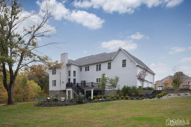 2 Joye Ln, South Brunswick, NJ 08852 - rear view of house featuring stairway, a wooden deck, a chimney, and a lawn