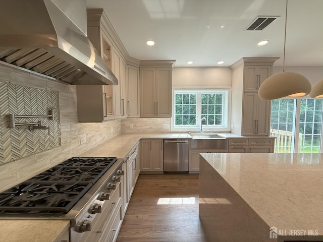 2 Joye Ln, South Brunswick, NJ 08852 - kitchen with wall chimney range hood, stainless steel appliances, recessed lighting, light stone countertops, and decorative backsplash