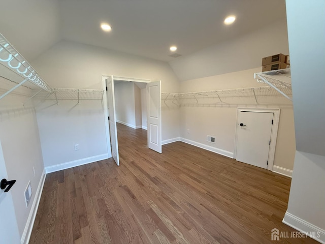 2 Joye Ln, South Brunswick, NJ 08852 - walk in closet featuring lofted ceiling and wood finished floors
