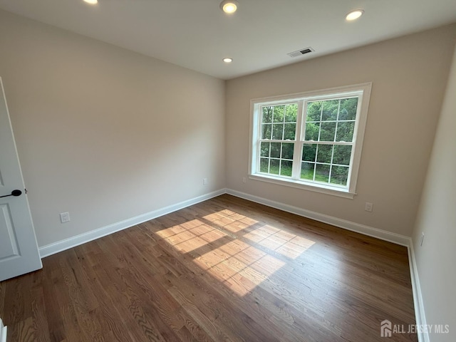 2 Joye Ln, South Brunswick, NJ 08852 - empty room with dark wood finished floors and recessed lighting