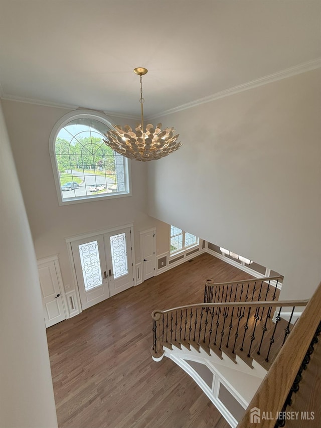 2 Joye Ln, South Brunswick, NJ 08852 - entryway featuring wood finished floors, french doors, a chandelier, crown molding, and a towering ceiling