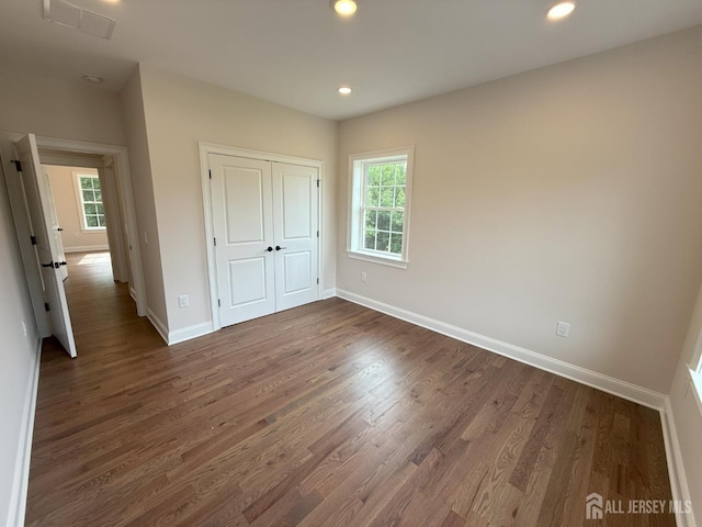 2 Joye Ln, South Brunswick, NJ 08852 - unfurnished bedroom with multiple windows, dark wood-style floors, recessed lighting, and a closet