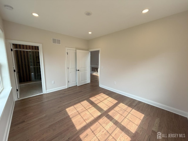 2 Joye Ln, South Brunswick, NJ 08852 - unfurnished bedroom featuring dark wood-style flooring, recessed lighting, and ensuite bath