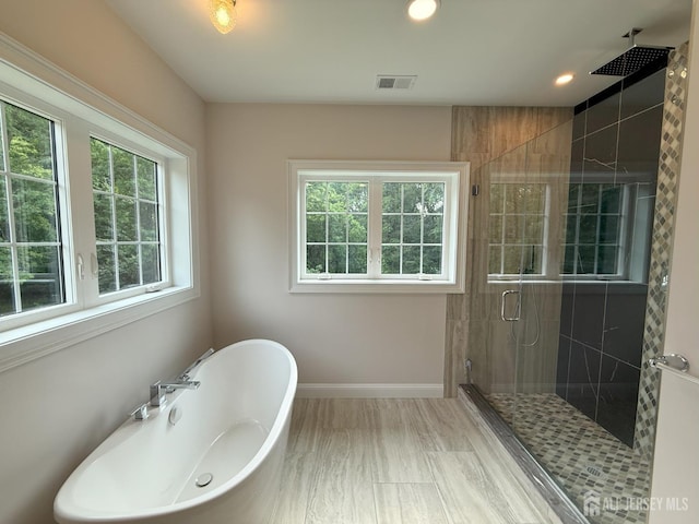 2 Joye Ln, South Brunswick, NJ 08852 - bathroom featuring a shower stall, a freestanding tub, and recessed lighting
