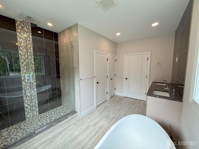 2 Joye Ln, South Brunswick, NJ 08852 - bathroom featuring a freestanding tub, a stall shower, recessed lighting, and double vanity