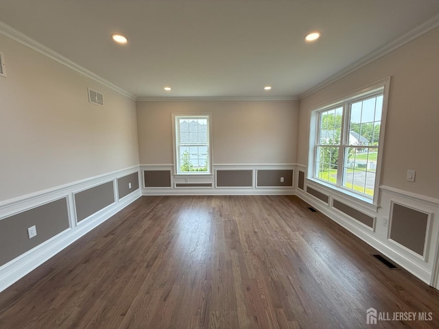 2 Joye Ln, South Brunswick, NJ 08852 - unfurnished room featuring plenty of natural light, ornamental molding, recessed lighting, a decorative wall, and dark wood finished floors