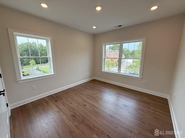 2 Joye Ln, South Brunswick, NJ 08852 - empty room featuring healthy amount of natural light, dark wood-style flooring, and recessed lighting