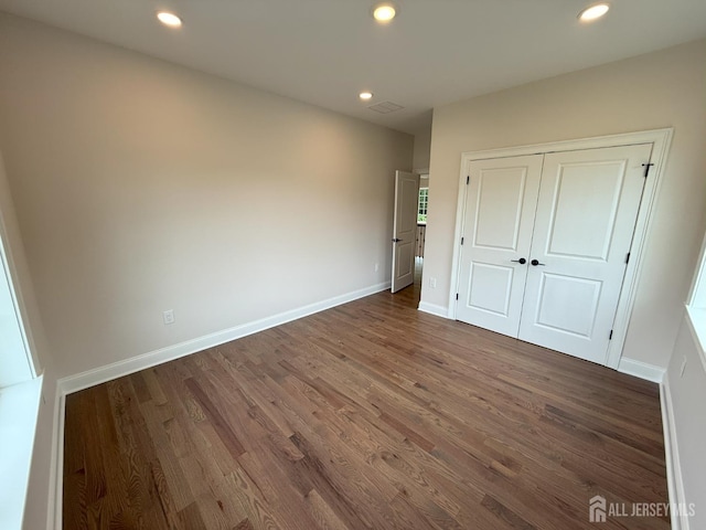 2 Joye Ln, South Brunswick, NJ 08852 - unfurnished bedroom featuring dark wood-style flooring, recessed lighting, and a closet