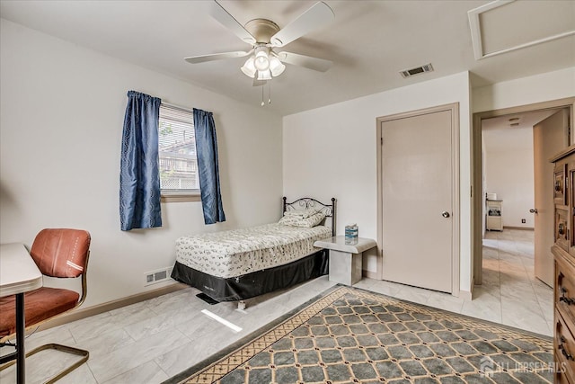 bedroom with a ceiling fan, baseboards, visible vents, and attic access
