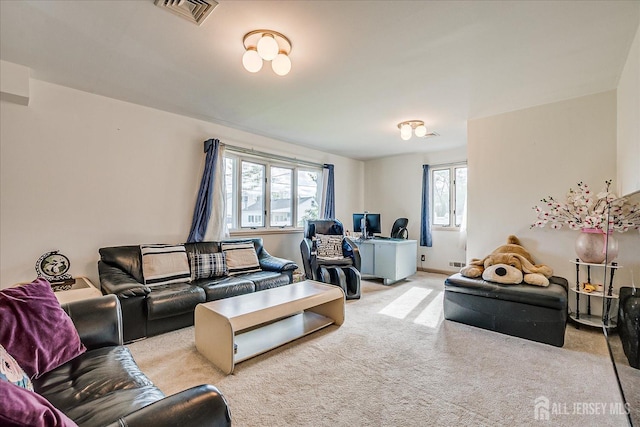 carpeted living area featuring visible vents