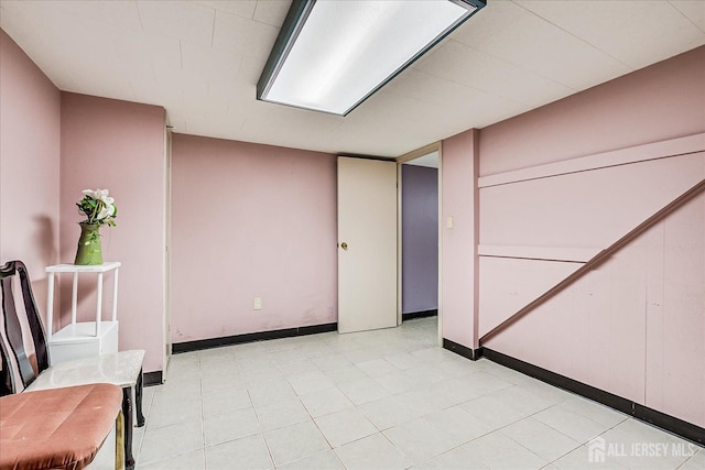 interior space featuring baseboards
