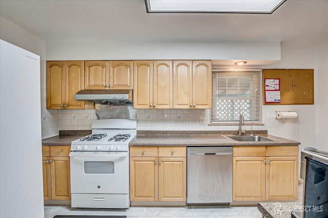 kitchen with stainless steel dishwasher, white gas range, under cabinet range hood, a sink, and backsplash
