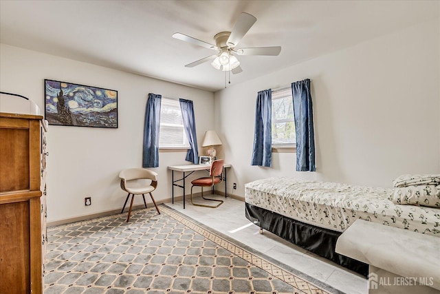 bedroom with baseboards, a ceiling fan, and tile patterned floors
