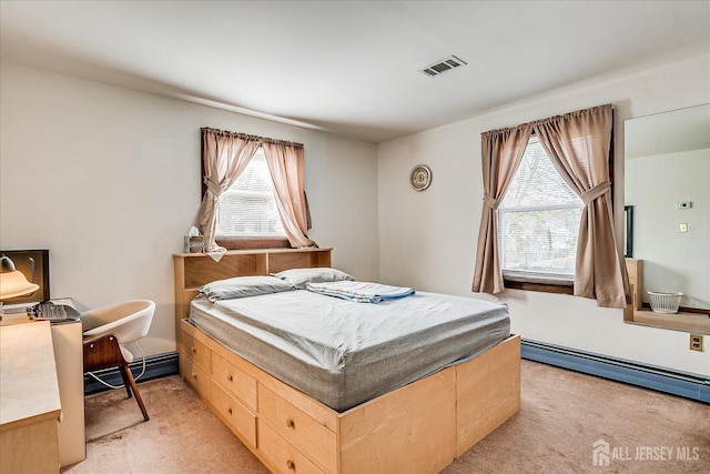 bedroom featuring visible vents, a baseboard radiator, and light colored carpet