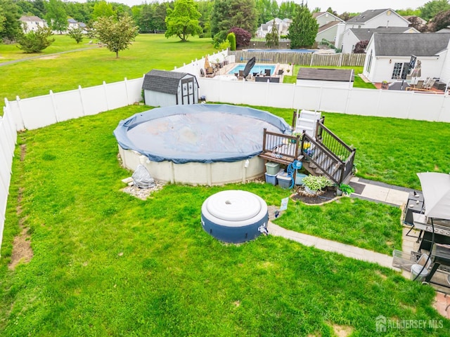 24 Higgins Rd, Old Bridge, NJ 08857 - view of yard with a wooden deck and a residential view