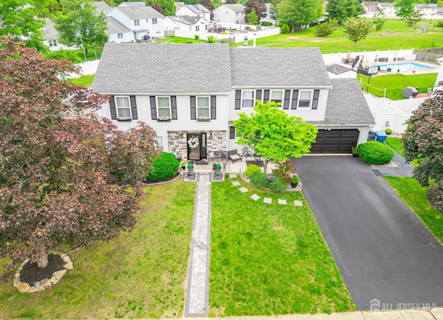 24 Higgins Rd, Old Bridge, NJ 08857 - view of front of house with roof with shingles, driveway, a residential view, and a front yard