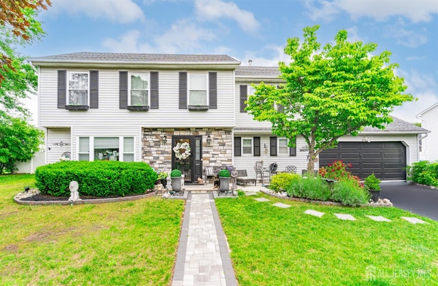 24 Higgins Rd, Old Bridge, NJ 08857 - view of front of house featuring a front yard, asphalt driveway, and an attached garage