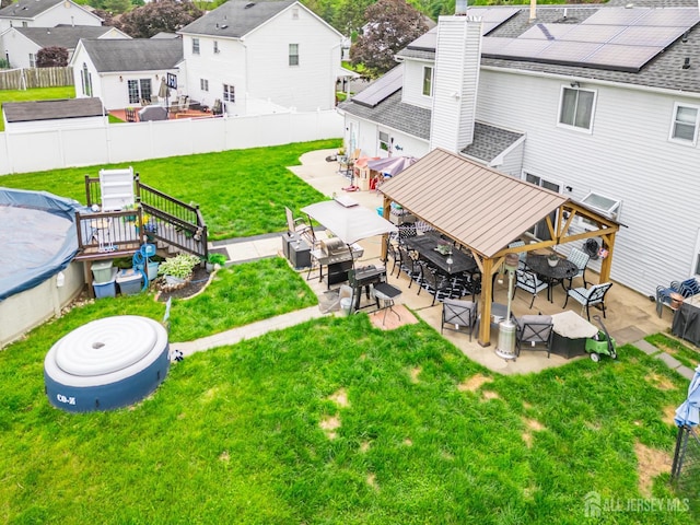 24 Higgins Rd, Old Bridge, NJ 08857 - view of yard featuring a patio, a residential view, outdoor dining area, and a deck