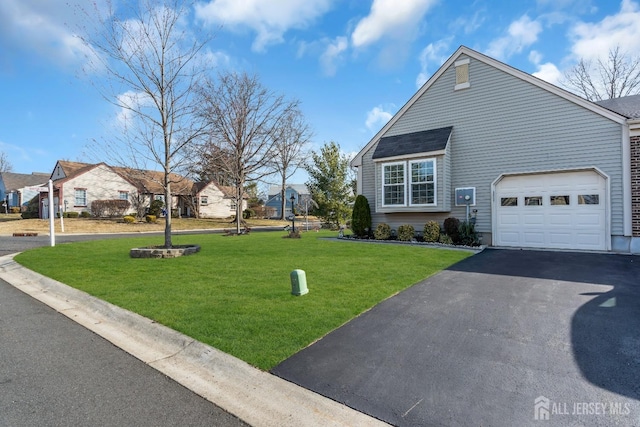 view of property exterior with aphalt driveway, a lawn, and an attached garage