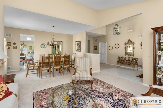 12 Wellfleet St, Monroe, NJ 08831 - living area featuring carpet floors, a chandelier, baseboards, and healthy amount of natural light