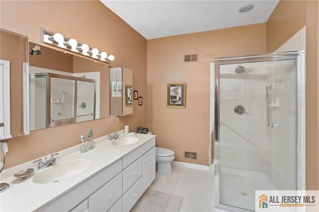 12 Wellfleet St, Monroe, NJ 08831 - bathroom with a stall shower, double vanity, toilet, tile patterned floors, and baseboards